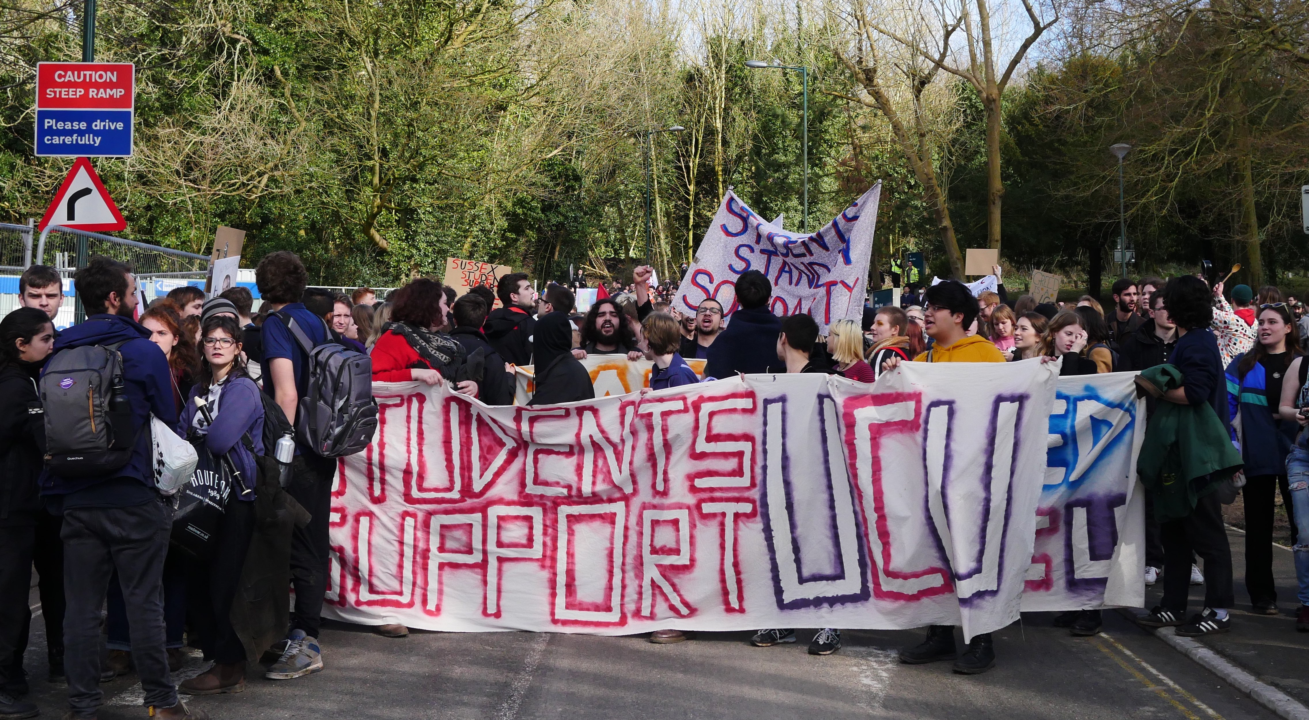 Students march in solidarity with staff, and against fees