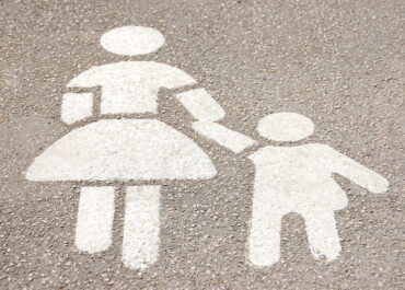 road marking of a mother and child